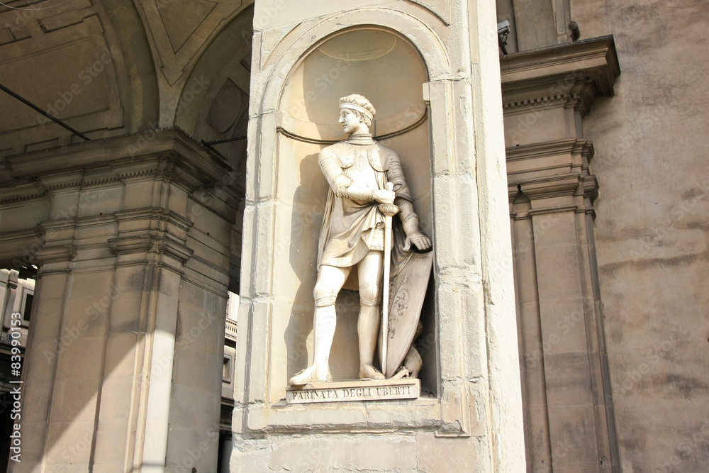 Medieval knight statue with sword and shield