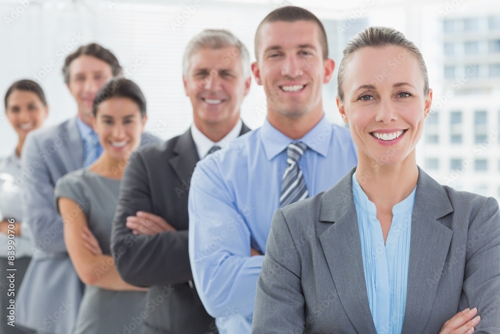 Smiling business team standing in a line Smiling business team standing in a line