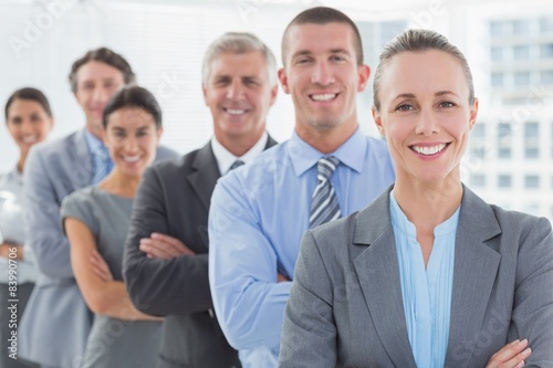 Smiling business team standing in a line