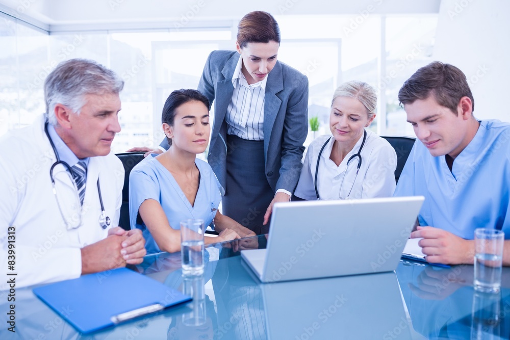 Team of doctors and businesswoman having a meeting Team of doctors and businesswoman having a meeting