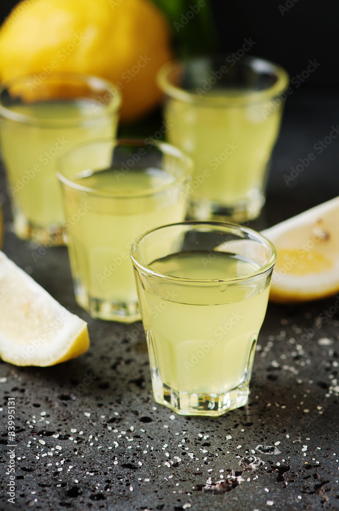 Fototapeta premium Italian traditional liqueur limoncello with lemon