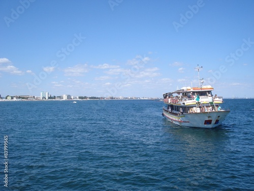 Pleasure ship with passengers, near Mamaia resort at Black Sea