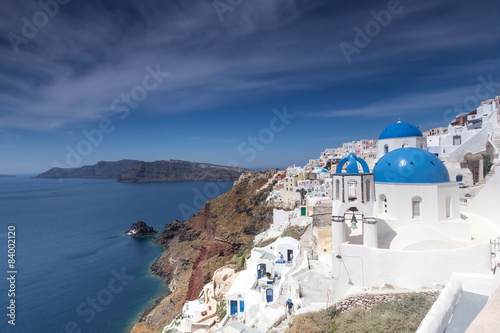 Fototapeta Naklejka Na Ścianę i Meble -  Blue and white church of Oia village on Santorini island. Greece