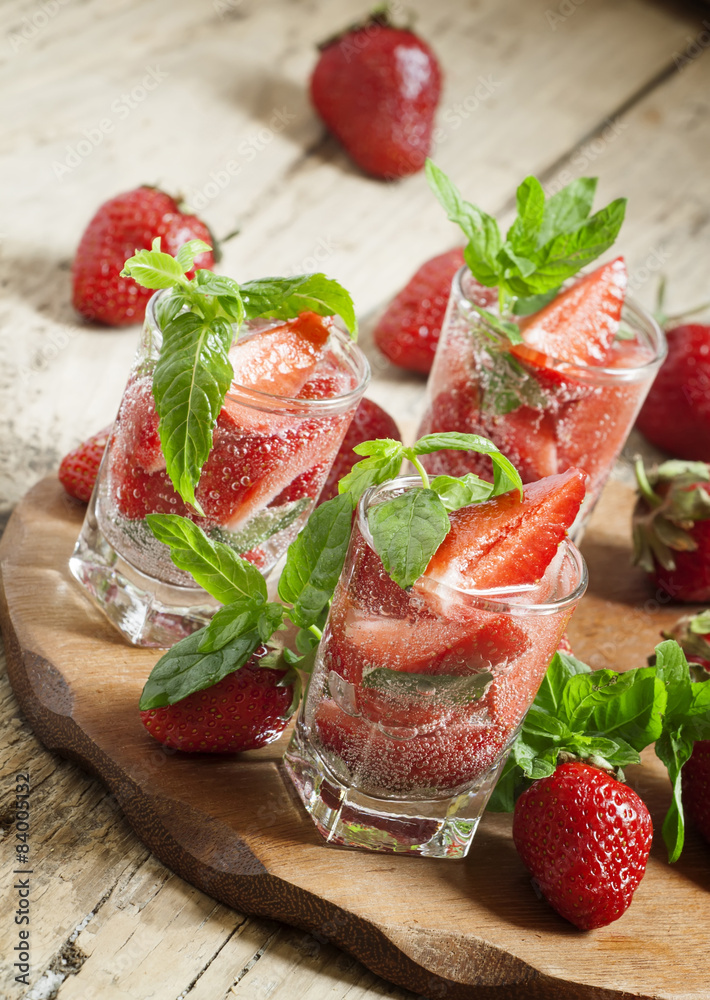 Refreshing strawberry drink with mint, selective focus