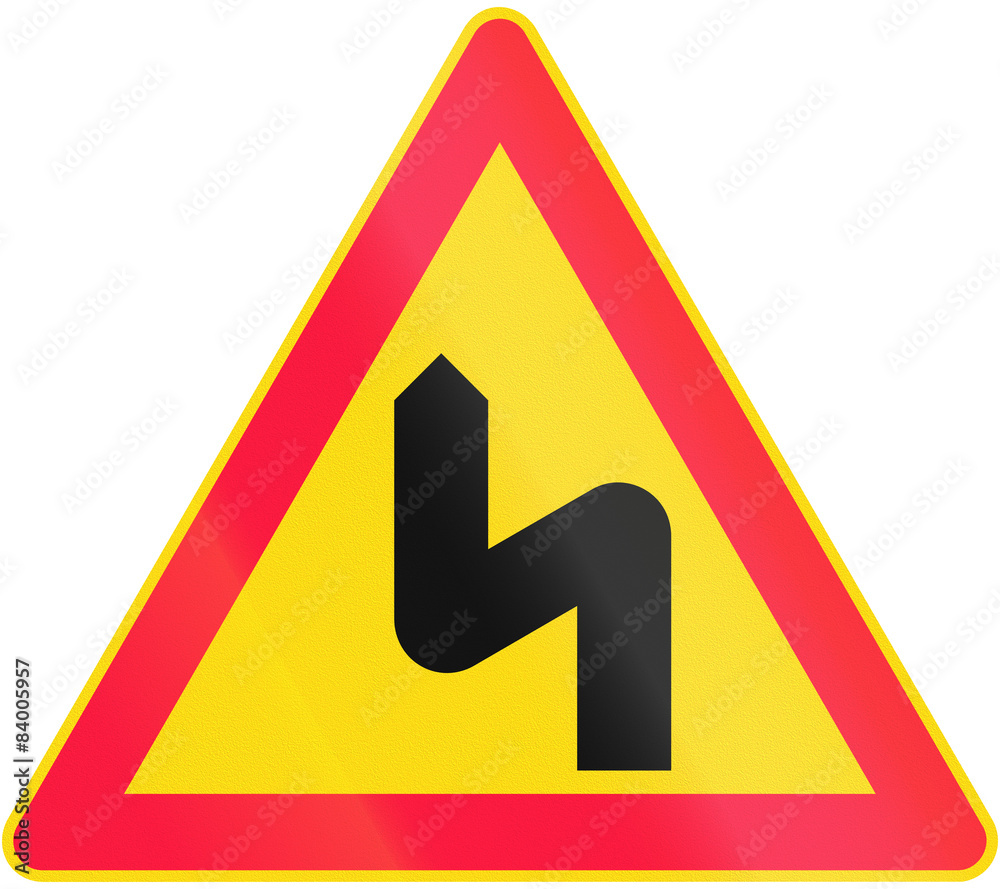 Road sign 114 in Finland - Series of bends, first to the left Road sign 114 in Finland - Series of bends, first to the left