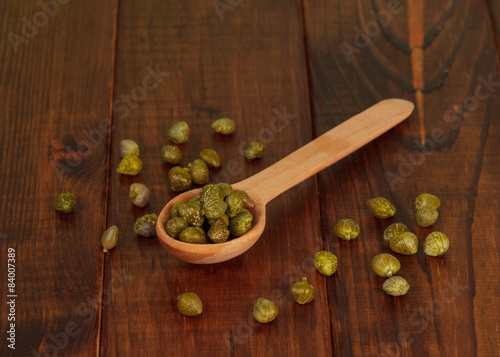 Green olives on the spoon photo