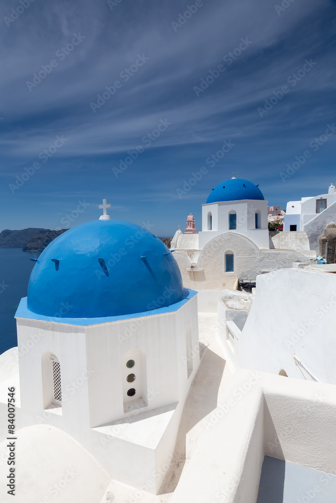 Blue and white church of Oia village on Santorini island. Greece