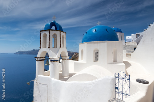 Blue and white church of Oia village on Santorini island. Greece