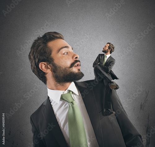 Businessman and his conscience photo