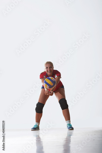 volleyball woman jump and kick ball isolated on white background