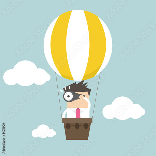 Businessman in balloon