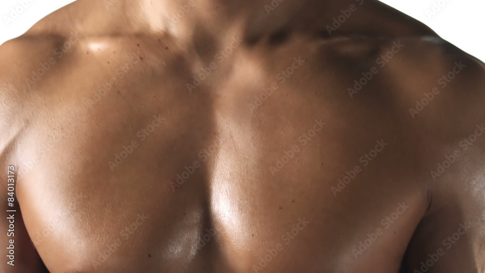 Close up shot of an ethnic athlete with no shirt on and big muscles Close up shot of an ethnic athlete with no shirt on and big muscles
