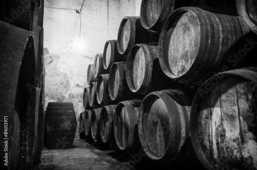 Slika na platnu Whisky or wine barrels in black and white