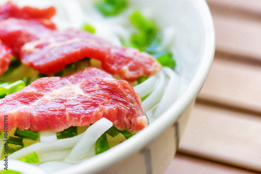 Closeup view of the Pho Bo. Popular beef noodle soup in Vietnam Closeup view of the Pho Bo. Popular beef noodle soup in Vietnam