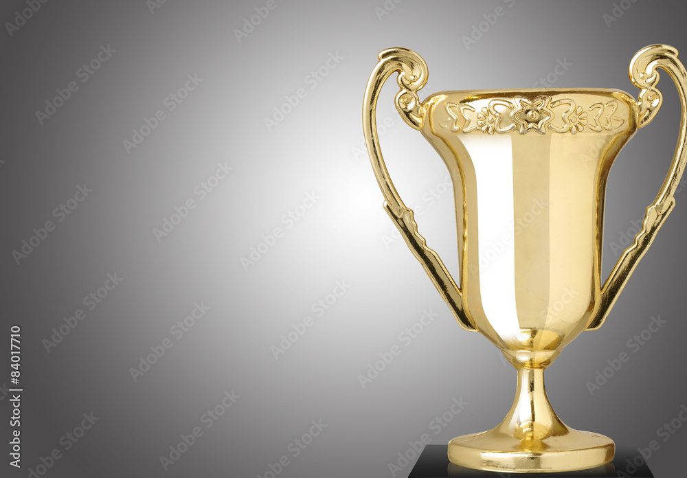 Golden cup trophy on gray background Golden cup trophy on gray background