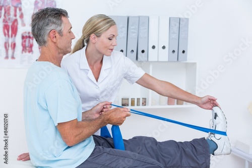 Картината върху платно Doctor examining her patient back legs