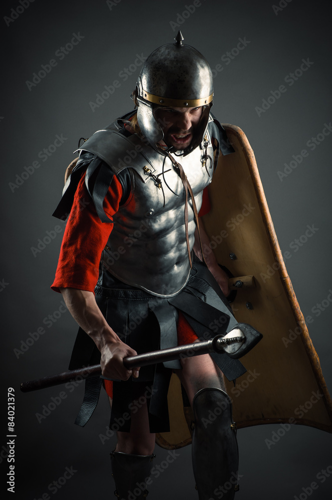 Naklejka premium aggressive brutal warrior attack with a spear