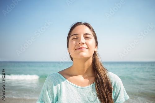 Happy woman relaxing in front of the sea 
