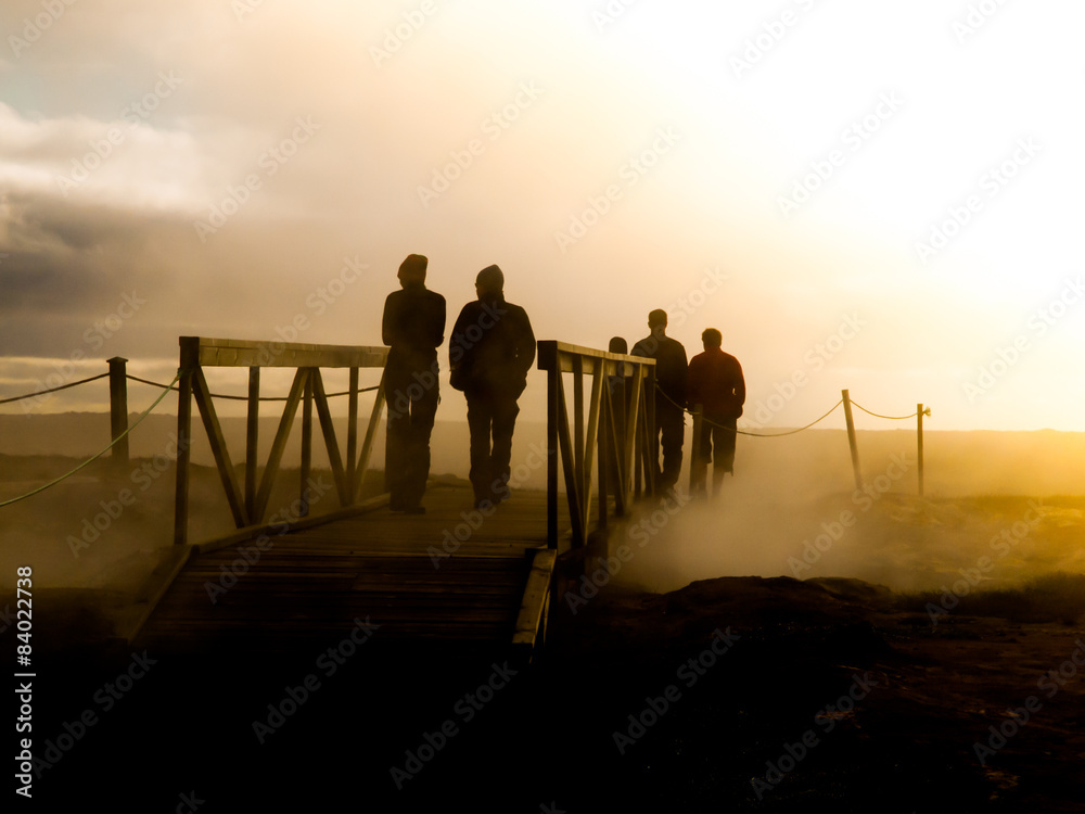 Silhouettes of people in the mist
