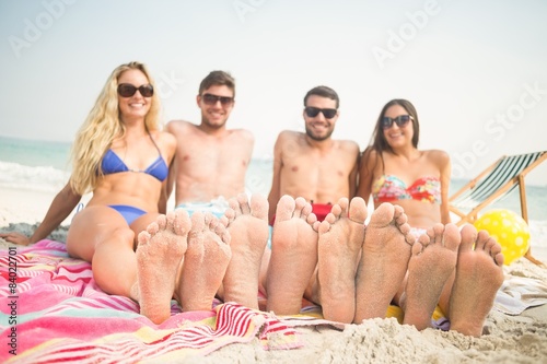 group of friends in swimsuits looking at camera