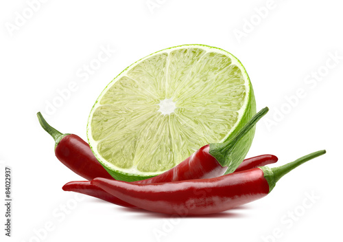 Lime cut and chili pepper isolated on white background