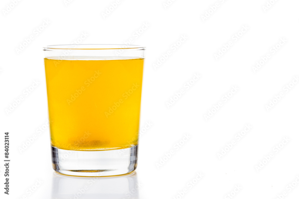 Effervescent vitamin C tablet bubbles in glass of water Effervescent vitamin C tablet bubbles in glass of water