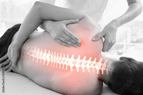 Highlighted spine of man at physiotherapy photo
