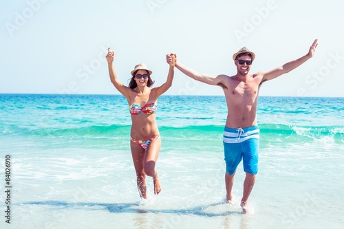 happy couple running on the sea  © WavebreakMediaMicro