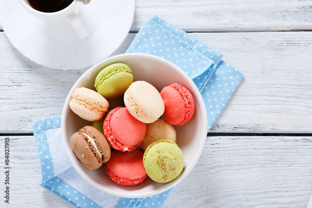 Various macaroon in a bowl on the boards Various macaroon in a bowl on the boards