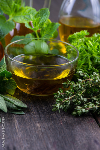 Fresh herbs from garden with olive oil