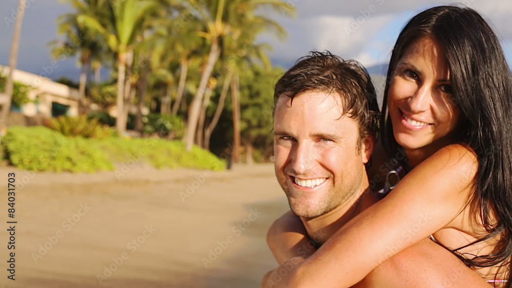 Medium shot of attractive mid adult couple looking at the camera and smiling Medium shot of attractive mid adult couple looking at the camera and smiling