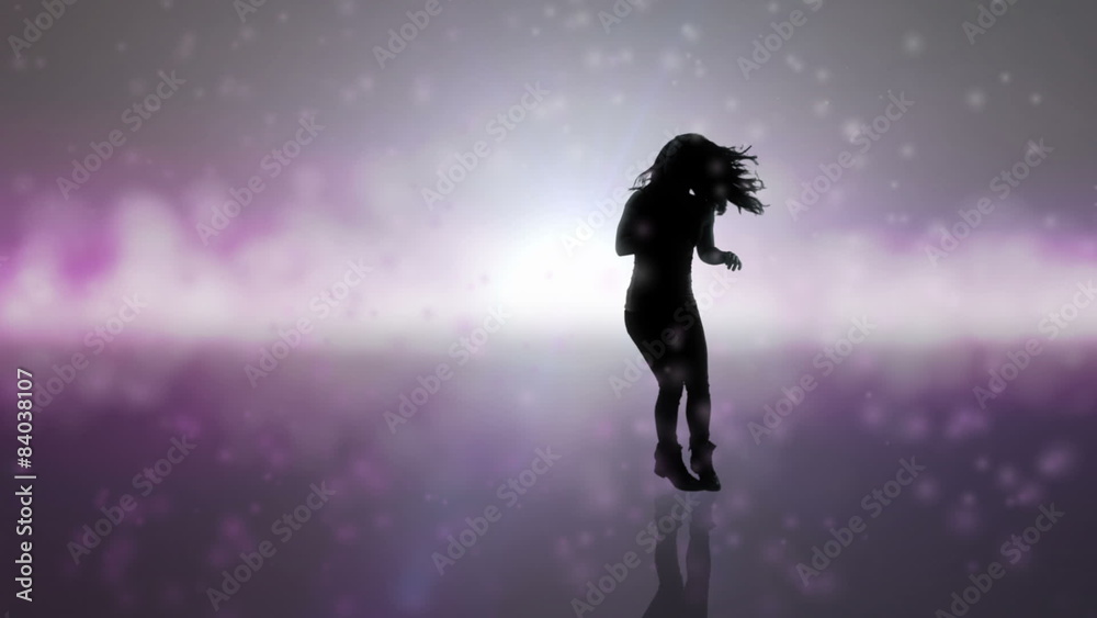 A young woman does amazing dance moves on a beautifully colored background A young woman does amazing dance moves on a beautifully colored background