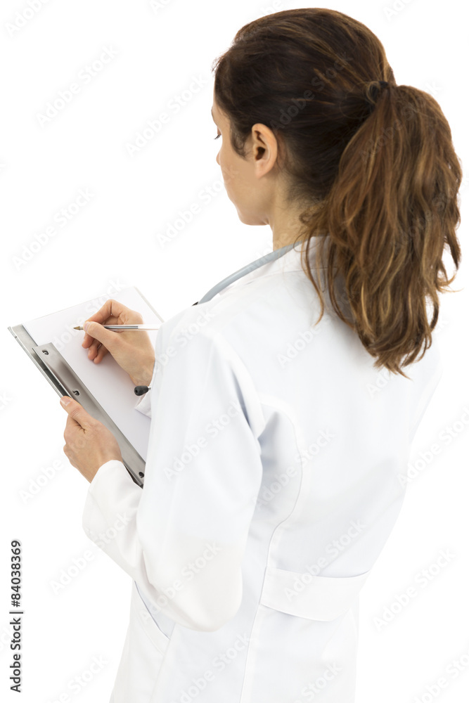Female doctor writing notes on a clipboard Female doctor writing notes on a clipboard