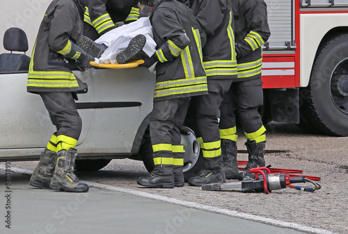 firefighters relieve an injured after car accident