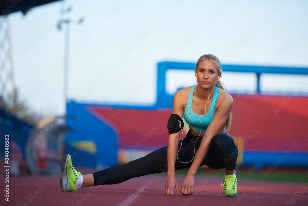 Fototapeta premium sporty woman on athletic race track