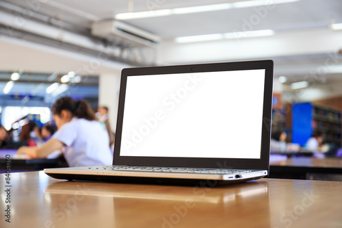 laptop with blank screen on the table in library