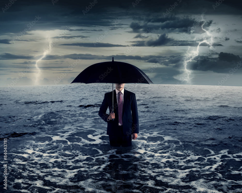 Business Man Holding Umbrella On The Sea
