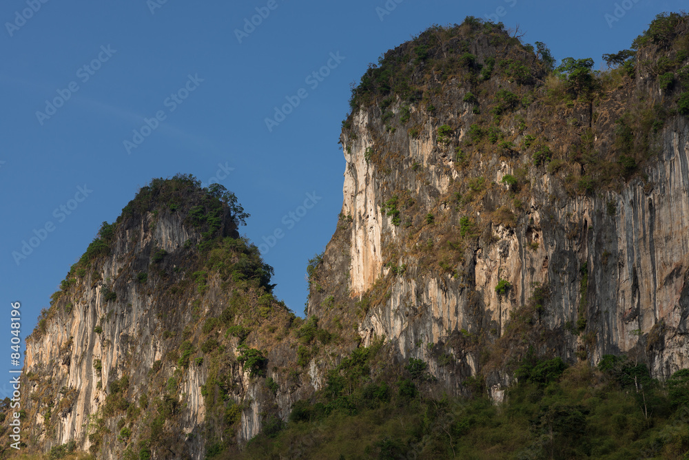 limestone cliff mountain blue sky