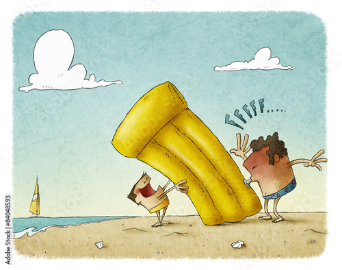 man is inflating a beach mat for his son