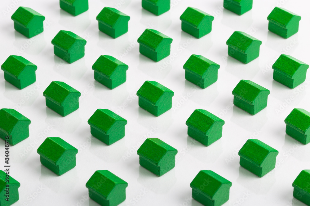 Grid of green houses making a community in the property market.