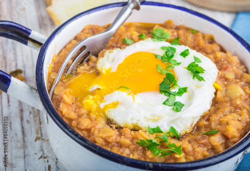 Fried egg with cooked lentils