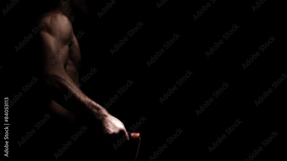 Male athlete jump ropes. Medium shot.