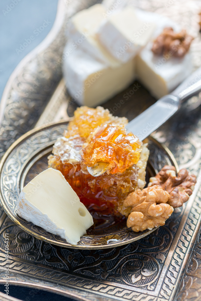 Honey comb, cheese and walnuts.