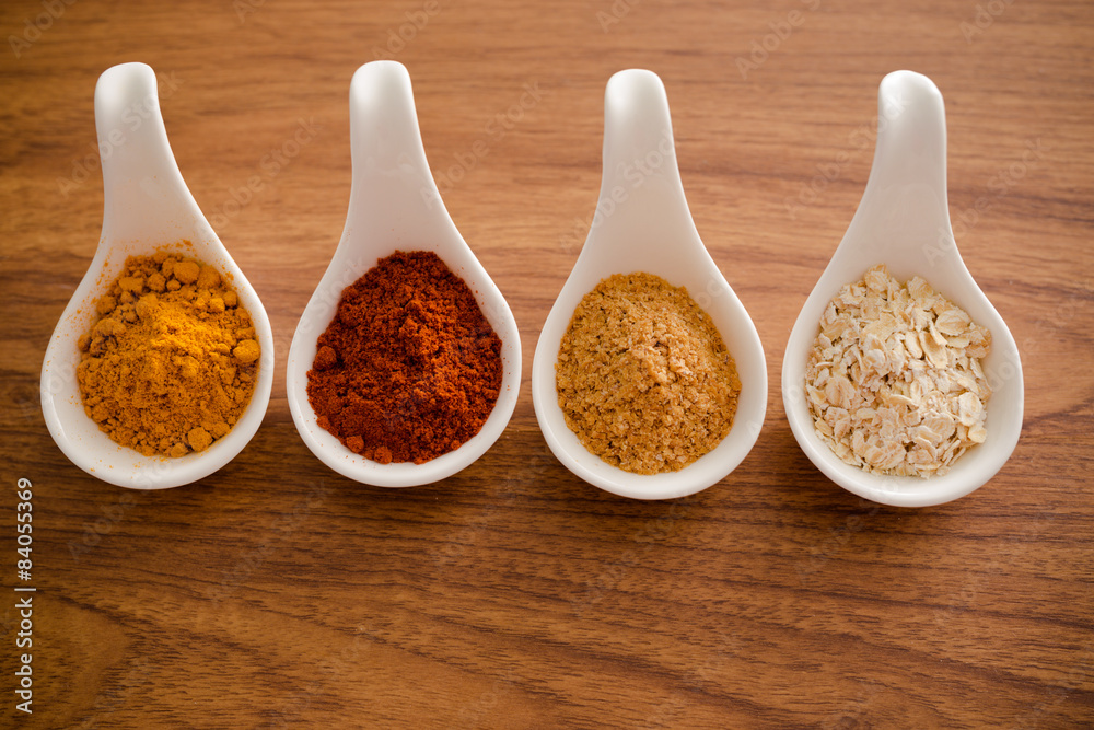 Wooden table of colorful spices Wooden table of colorful spices