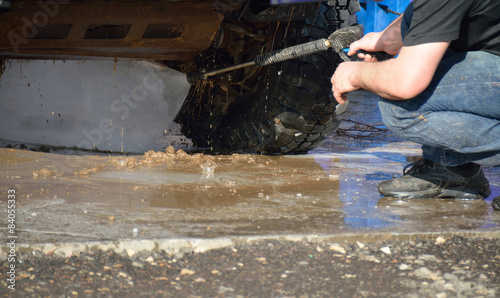 man washing the back of the car