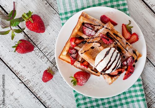 Belgium waffles with strawberries and ice cream 
