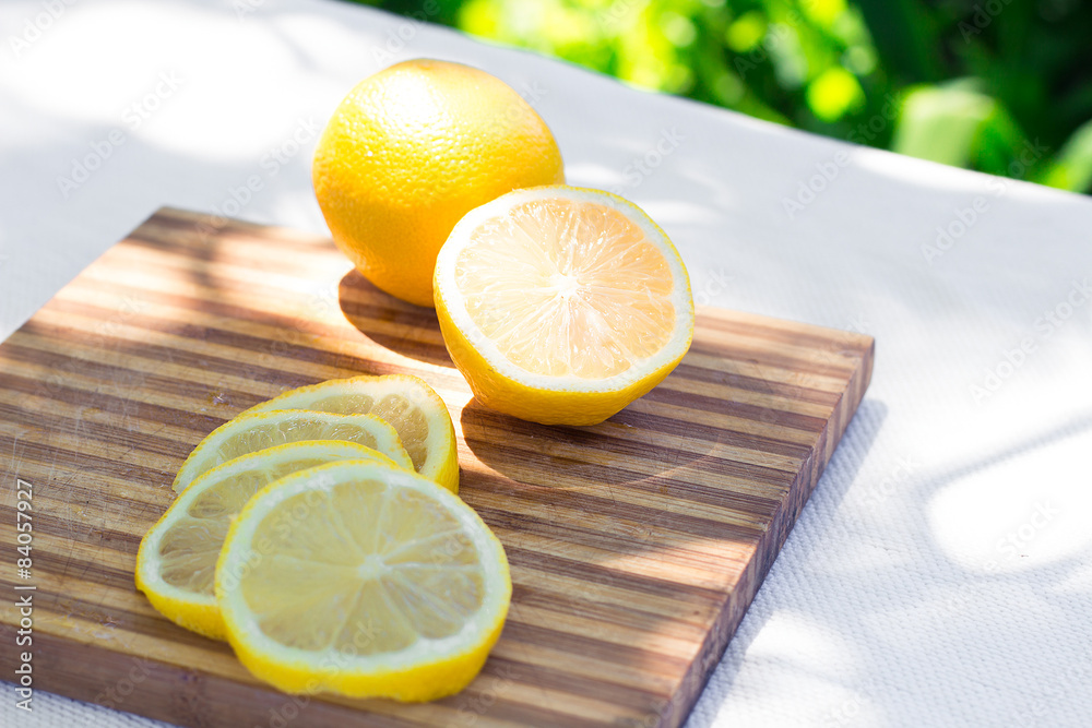 Fresh lemon slices on a cutting board Fresh lemon slices on a cutting board