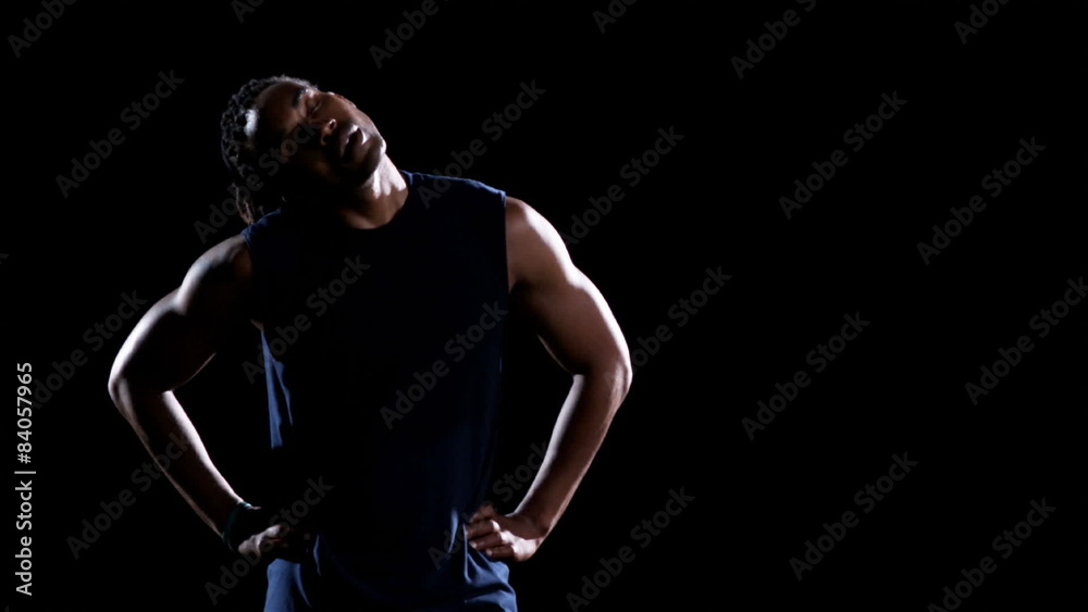 A male athlete breathes heavy and sweats after a work A male athlete breathes heavy and sweats after a work