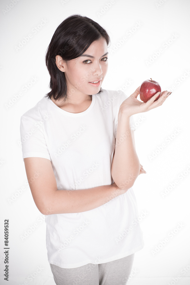 Smiling woman with apple isolated on white Smiling woman with apple isolated on white
