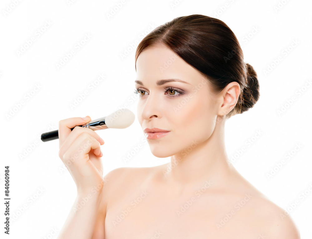 Beauty portrait of young woman holding makeup brushes Beauty portrait of young woman holding makeup brushes